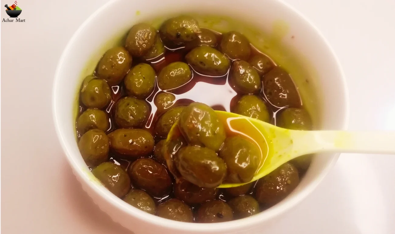 "Jar of Olive Pickle with vibrant olives and spices."